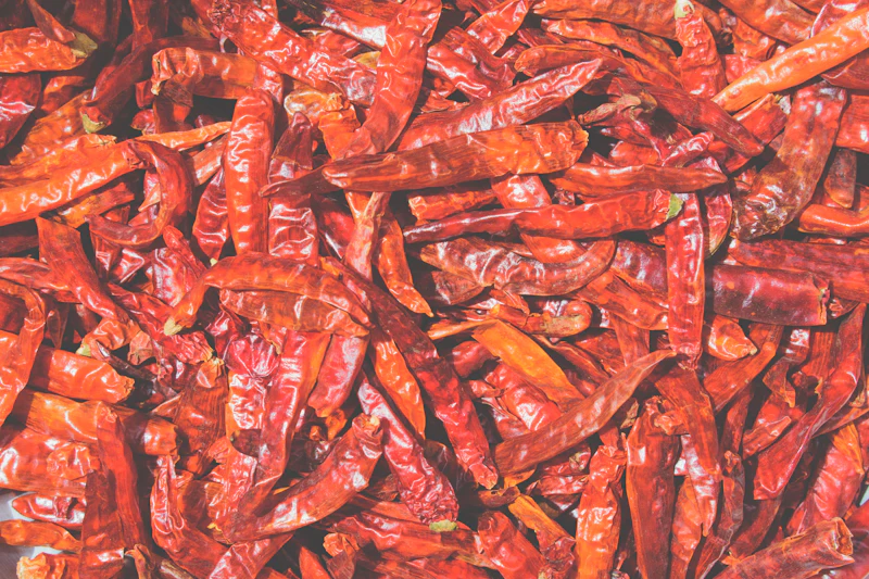 A heap of dried orange-red chillies